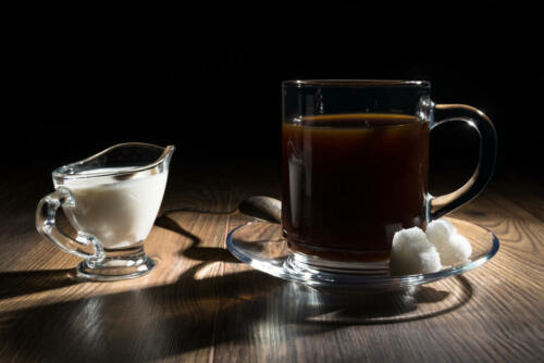 Coffee, milk, spoon and sugar